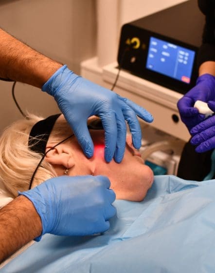 doctor and nurse performing endolift treatment on a patient