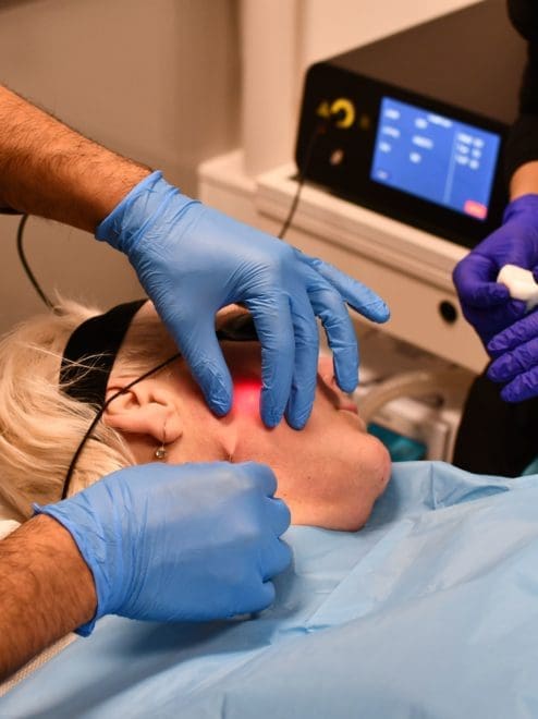 doctor and nurse performing endolift treatment on a patient