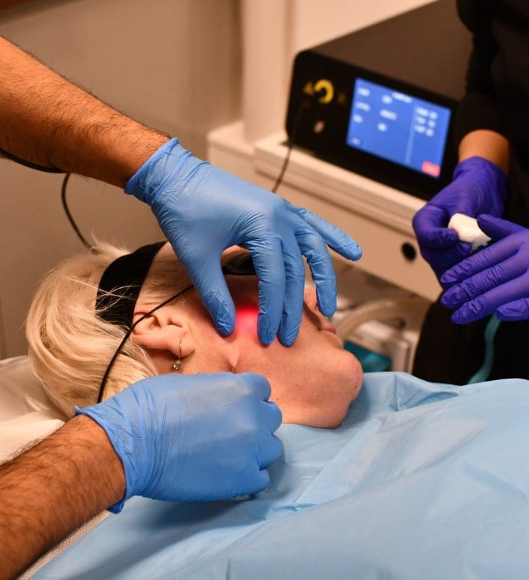 doctor and nurse performing endolift treatment on a patient