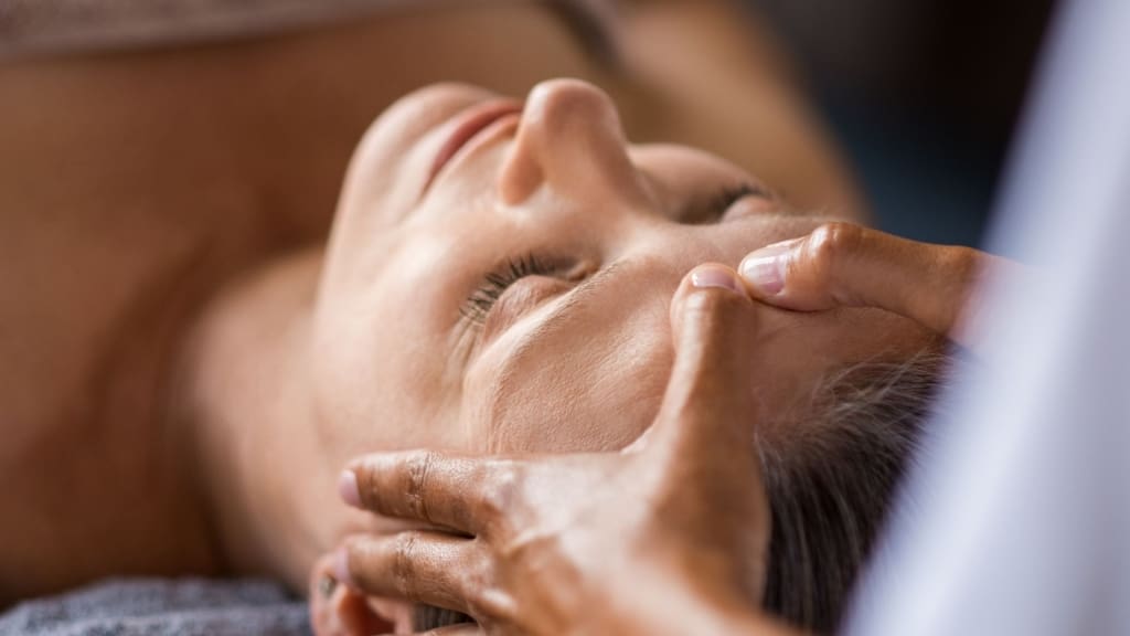 woman getting a facial cleanse